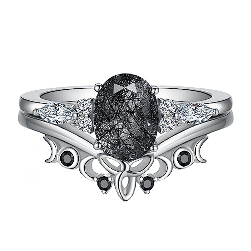 IRROYA 6x8mm Oval Natural Black Rutilated Quartz Wedding Sets - Trinity Celtic Knot V Shaped Wedding Ring - Genuine Moissanite Ring Set - Round Cut Black Spinel Wedding Band - Platinum Plated Sterling Silver Rings - Gifts For Women - 925 Silver Bridal Ring Sets - Promise Rings For Her (7.5)