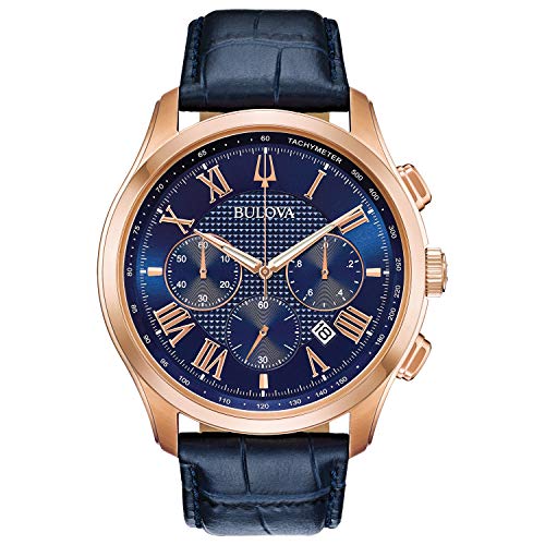 Bulova Men's Classic Wilton 3-Hand 21-Jewel Watch, 60 Hour Power Reserve, Luminous Hands, Open Aperture, Roman Numeral Markers Domed Sapphire Crystal, 43mm, Blue Strap/ Rose Gold